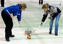 Women Curling on Ice